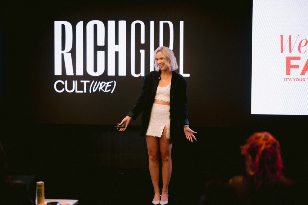 Katrina Owens, an expert in PR and Personal Branding in Los Angeles, speaks on stage at an event for entrepreneurs