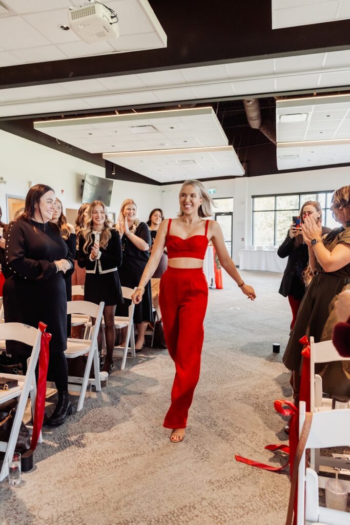 Keynote Speaker and Author Katrina Owens moves towards the stage at an event for entrepreneurs to discuss tips for creating a personal brand