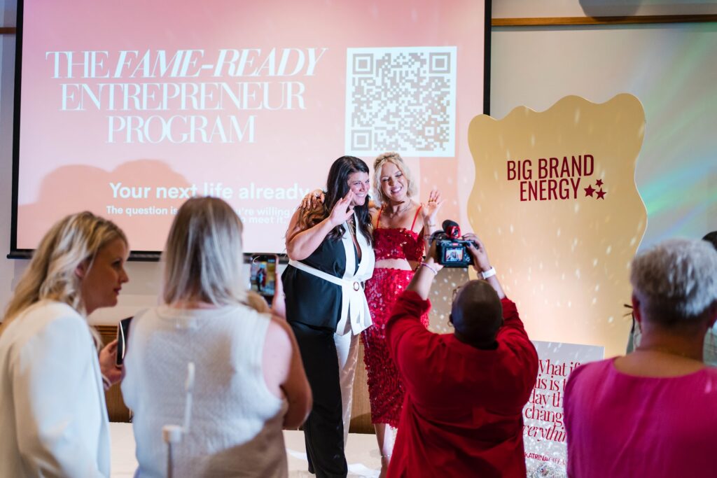 Professional keynote speaker Katrina Owens takes photos with audience members after delivering her personal branding keynote